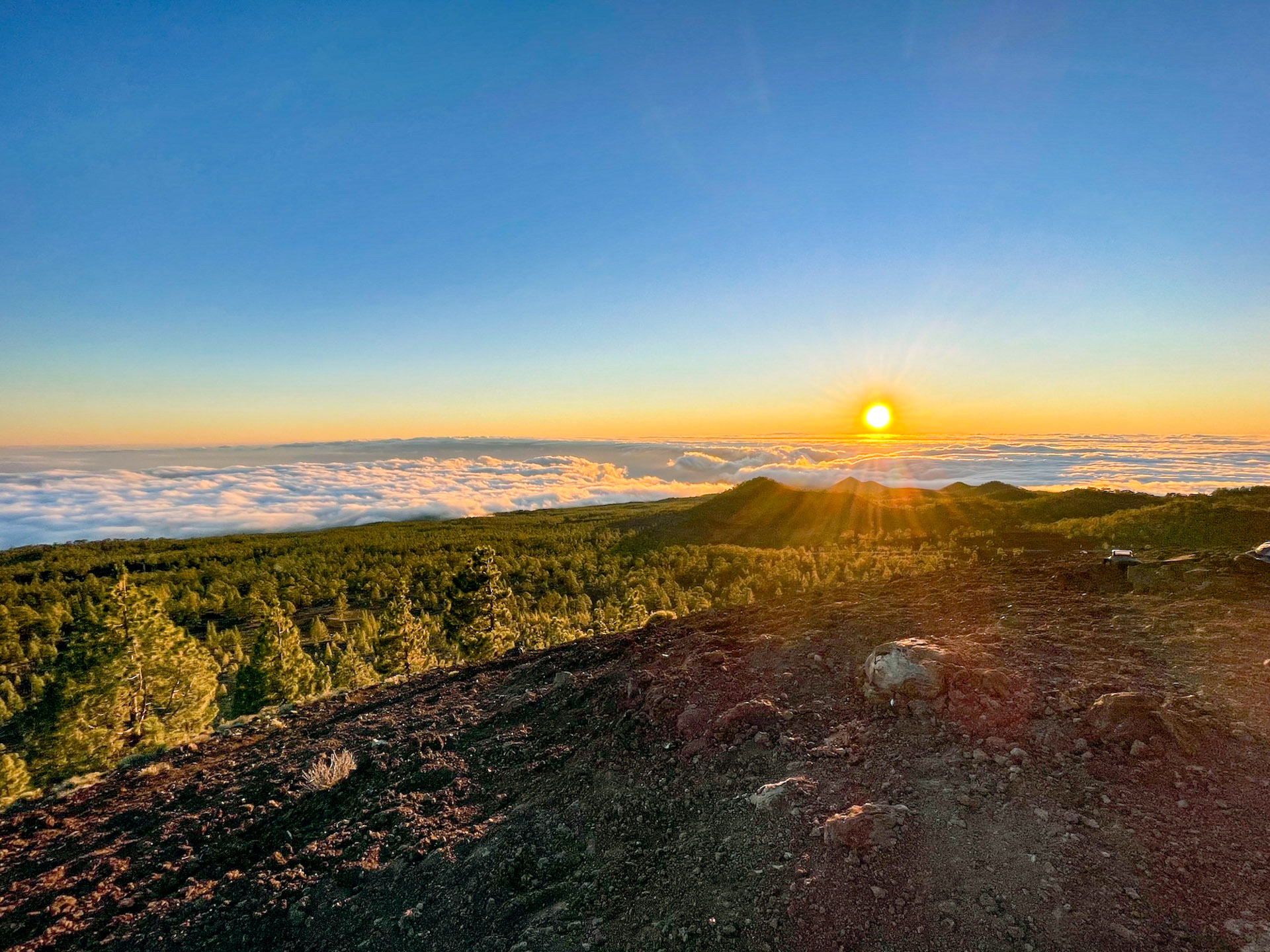 The sun setting above the clouds as seen near the top of Teide.